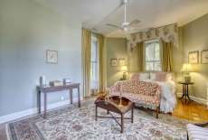 The Armstrong Suite, named after Francis Armstrong, a past owner of Magnolia Manor, Features a King size bed, private bathroom with shower and pool views.