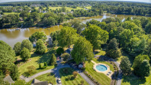 Aerial view of magnolia manor with pool and Tred Avon River